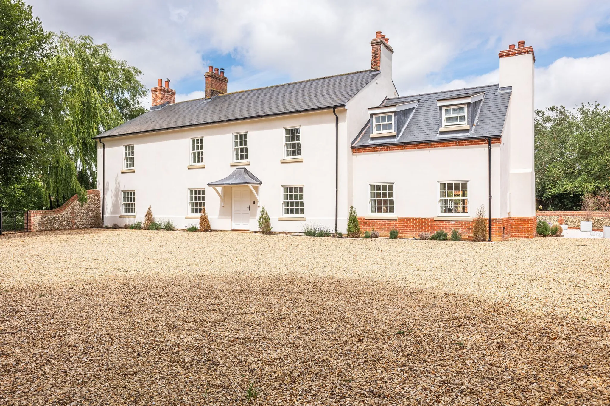 English country house with gravel driveway