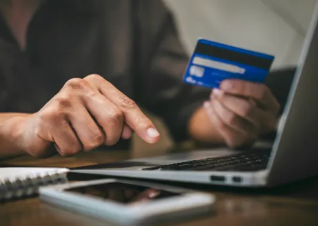 Image of someone paying a deposit online