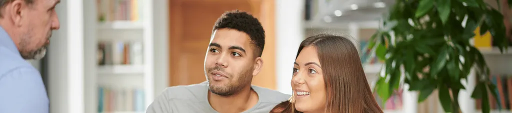 Banner image of two people discussing the costs of buying a home