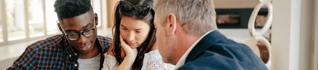 Banner image of people discussing a mortgage
